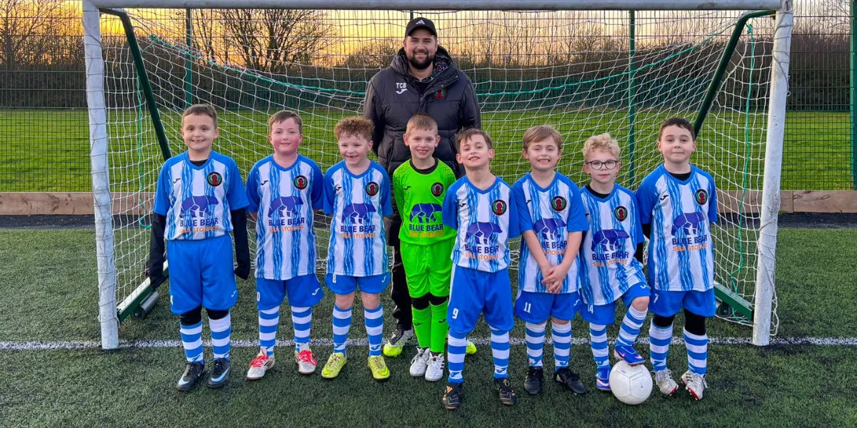 Corby Hellenic Fisher U7 Hurricanes wearing their Blue Bear Storage sponsored shirts